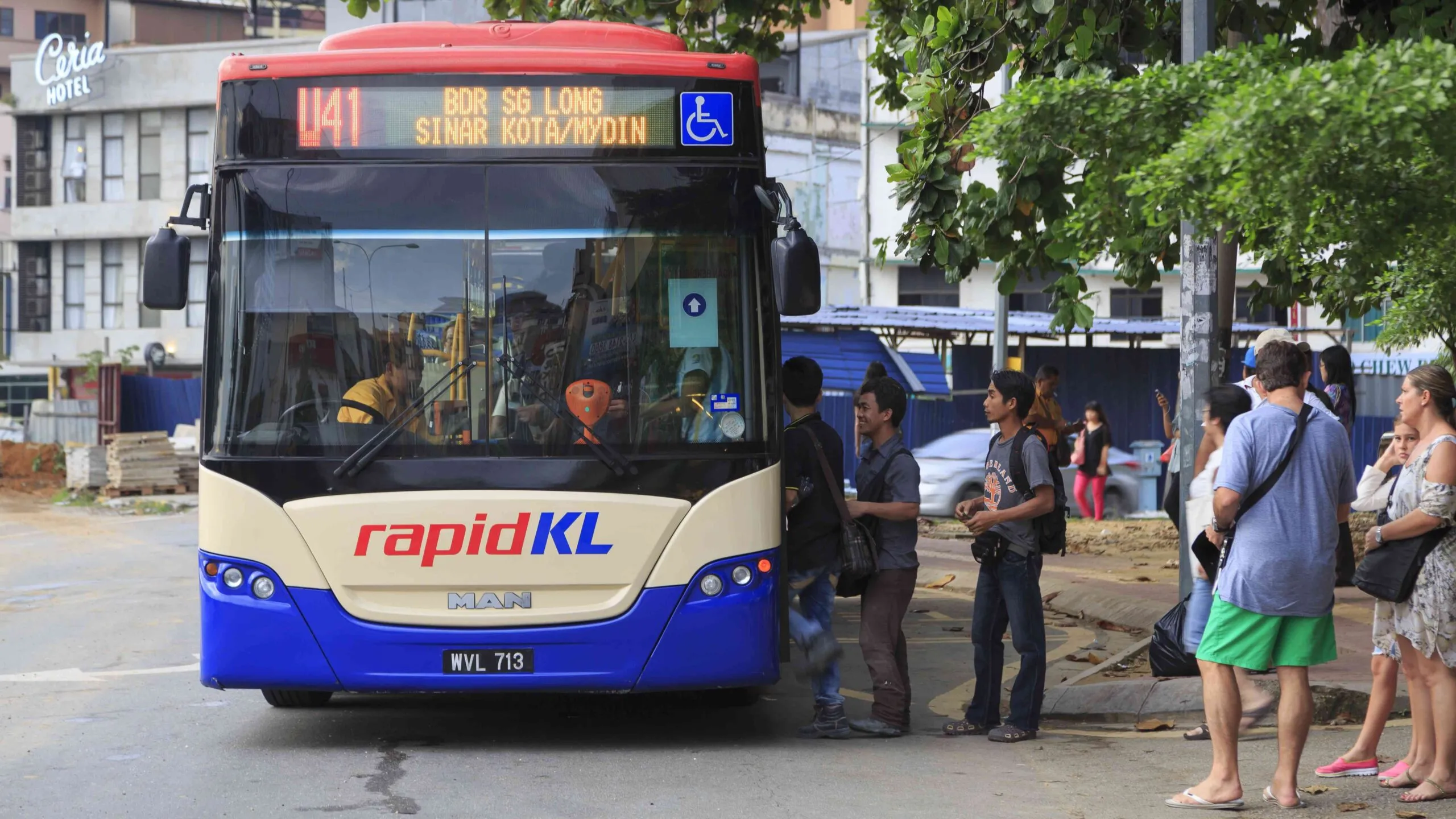 RapidKL bus picking up passengers in Kuala Lumpur, Malaysia, representing public transport upgrades under the 13th Malaysia Plan.