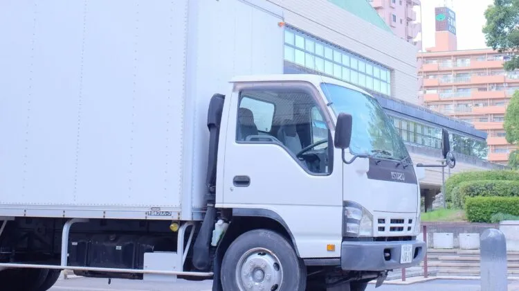 A white Isuzu truck.
